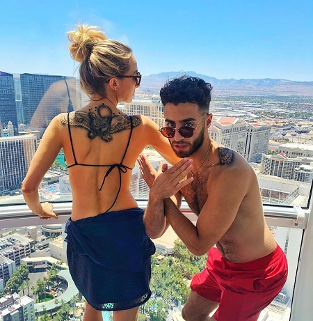 Nikki and her close friend posing together with a same tatto on their back
